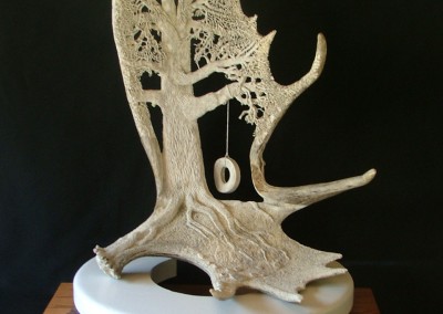 Antler carving of tire swing